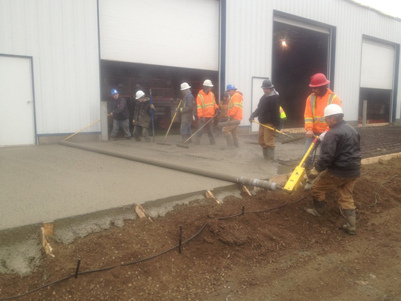 workers laying concrete